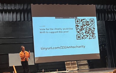 Senior officer Payten Hall informing fellow NHS members to vote for this year's charity.